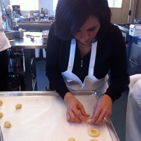Maria making Brazilian thumbprint cookies